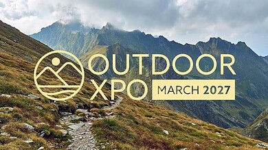 Scenic mountain trail in lush green landscape during outdoor event in March 2027.